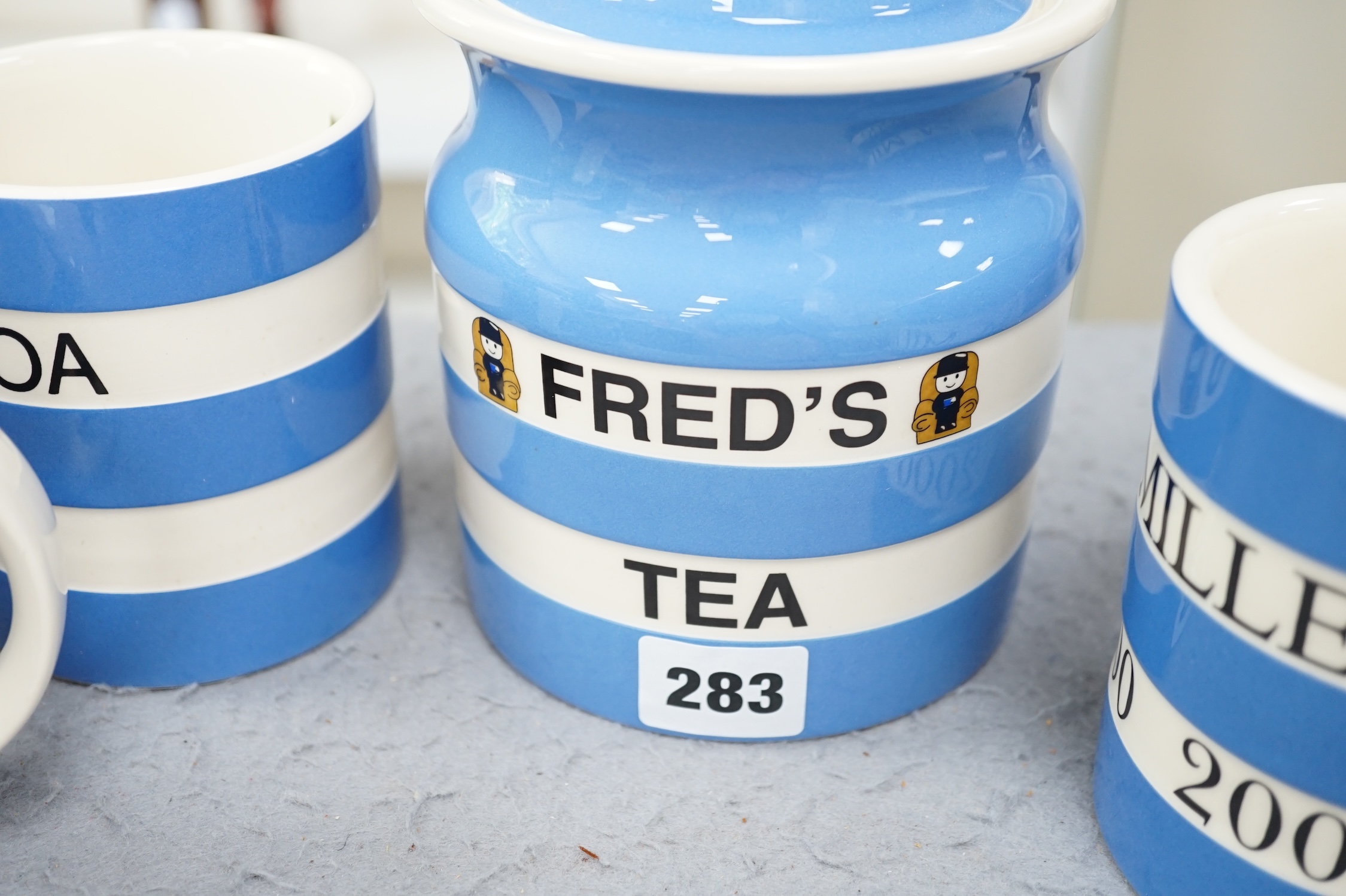 T.G.Green Cornish Kitchenware, nine modern limited edition pieces, to include a Fred's Tea lidded storage jar, 17cm high, Cocoa mug, jelly mould, flour sifter, etc. Condition - good